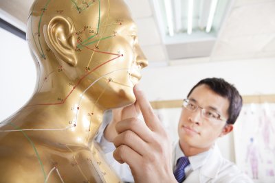 Doctor checking the acupuncture points